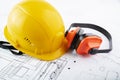 Occupational Safety and Health, labor protection, hse, anti noise headphones and engineer`s helmet on a white background