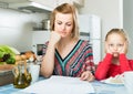 woman working from home, little daughter asking for attention Royalty Free Stock Photo