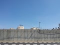 Occupied Palestinian suburb behind closed wall