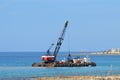 Ocean barge dredger in Cyprus clearing silt.