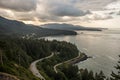 Ocean of bay with forest and roads in the cloudy sky Royalty Free Stock Photo