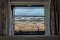 Ocean beach Sea view from the window of a camping caravan camper trailer. Road trip on the coast of sweden Royalty Free Stock Photo