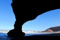 Ocean beach stone arch silhouette Royalty Free Stock Photo