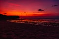 Ocean beach with waves and reflection at sunset or sunrise in Bali Royalty Free Stock Photo