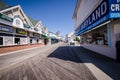 Ocean City, Maryland - Empty boardwalk with no people and closed restaurants and stores in early spring during a