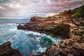 Ocean cliff bay with blue clear water at sunset time on Maui tropical island, Hawaii. Royalty Free Stock Photo