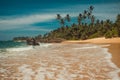 Ocean Coast with coconut palm trees. Tropical vacation, holiday background. Soft wave on wild deserted untouched beach. Paradise i Royalty Free Stock Photo