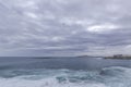 Ocean coast time-lapse during afternoon day with fast moving bright clouds moving sea and taking off planes from Gran Canary Royalty Free Stock Photo