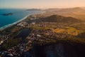 Ocean coastline with mountains and town with sunset lights in Campeche, Florianopolis