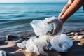 Ocean conservation: One person cleans up beach litter with care