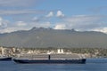 Ocean cruise liner sets sail from the modern seaside city Royalty Free Stock Photo