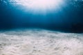Ocean in the deep with white sandy bottom and underwater sun rays in Hawaii Royalty Free Stock Photo