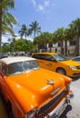 Yellow cab and classic vintage car, Miami Beach, Miami, Florida