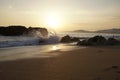 Ocean in the evening. Sunset over the waves. Clouds and bright colors of the evening sky.