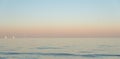 Ocean during evening with three yachts Royalty Free Stock Photo