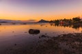 Sea with fishing boats and town at sunset time in Mauritius Royalty Free Stock Photo