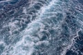 Ocean foaming water behind ferry stern. Trail on water surface. Wake of a ferry. Foaming sea water behind the stern of the ship. Royalty Free Stock Photo