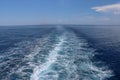 Ocean foaming water behind ferry stern. Trail on water surface. Wake of a ferry. Foaming sea water behind the stern of the ship. Royalty Free Stock Photo