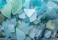 Ocean glass patterns on backgrounds with hands holding and grabbing, blues, whites, brown, green. Crafts