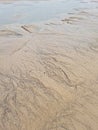 Pattern created by tide water on sand Royalty Free Stock Photo