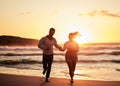 Ocean, holiday and sunset, running couple on beach happy holding hands. Love, romance and man and woman run in evening Royalty Free Stock Photo