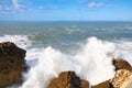 Ocean Huge waves crashing on the rocks of Nazare.