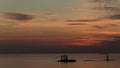 Ocean landscape at sunset. Silhouettes of fishermen. Royalty Free Stock Photo