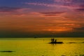 Ocean landscape at sunset. Silhouettes of fishermen. Royalty Free Stock Photo