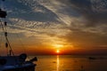 Ocean landscape at sunset. Silhouettes of fishermen and fishing Royalty Free Stock Photo