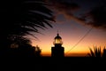 Ocean lighthouse during the sunset. Dramatic clouds on the background. Royalty Free Stock Photo