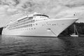 Ocean liner in sea in Fowey, United Kingdom. Cruise ship at seacoast on cloudy sky. Summer vacation on tropical island Royalty Free Stock Photo