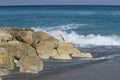 Ocean meets beach rock along the South Florida coastline Royalty Free Stock Photo