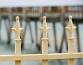 Ocean Pier Behind Iron Fence Spikes