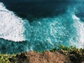 Ocean and rip curl view from abrupt cliff coast, Bali sea landscape