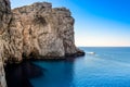 Ocean rocky landscape with the boat, near Neptune's cave, Sardin Royalty Free Stock Photo