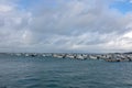 Ocean with rows of moored boats on the water surface against the background of the horizon. Royalty Free Stock Photo