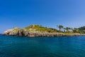 Ocean, San Nicolas island, grassy rocky isle. Lekeitio, Basque Country, Spain Royalty Free Stock Photo