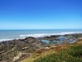 ocean sea with stone beach and pools seen from height