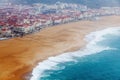 Ocean shore in Nazare, Portugal, in rainy foggy weather