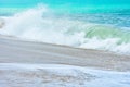 An ocean shorebreak in front view. Big beautiful green blue wave splashing with backwave and ready to break out. White foam Royalty Free Stock Photo