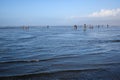 OCEAN SHORES, WA/USA Ã¢â¬â NOVEMBER 24, 2019: Copalis Beach, people out digging for razor clams at low tide in late afternoon. Royalty Free Stock Photo