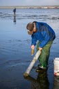 OCEAN SHORES, WA/USA Ã¢â¬â NOVEMBER 24, 2019: Copalis Beach, people out digging for razor clams at low tide in late afternoon. Royalty Free Stock Photo