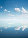 Ocean and sky background with reflecting clouds Royalty Free Stock Photo