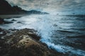 Ocean splash against close foreground rock at Hug Point, Oregon