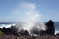 Ocean spray from large waves crashing into lava rock on the shore of Laupahoehoe Point on the Hamakua Coast, Hawaii