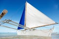 Ocean summer day view with blue sea and sky with white clouds and white sailing boat Royalty Free Stock Photo