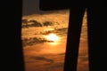 The sunrise is framed by the pier pilings on the Amelia Island Beach