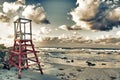 Ocean at sunset with abandoned life guard post in Guanabo beach, Cuba