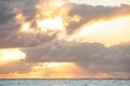 Ocean sunset with dramatic clouds and sun rays. Royalty Free Stock Photo