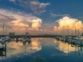 Sailboats moored at harbor against sky during sunset Royalty Free Stock Photo